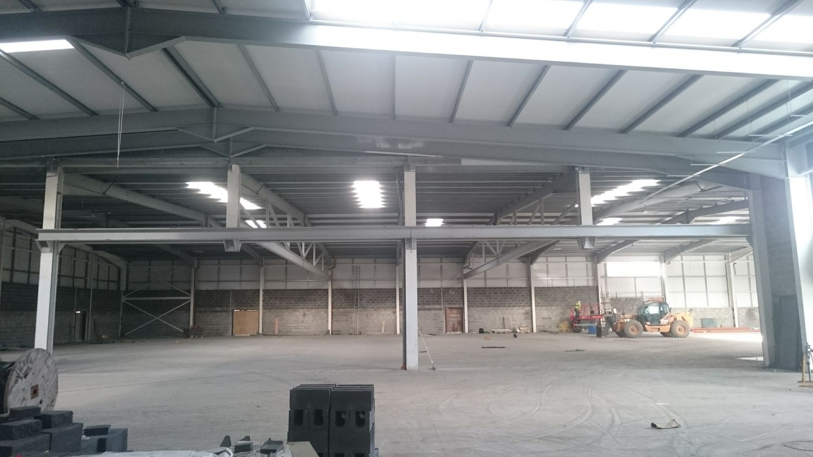 View of modified portal frames, fabricated to become trussed frames in order to enable the removal of existing columns